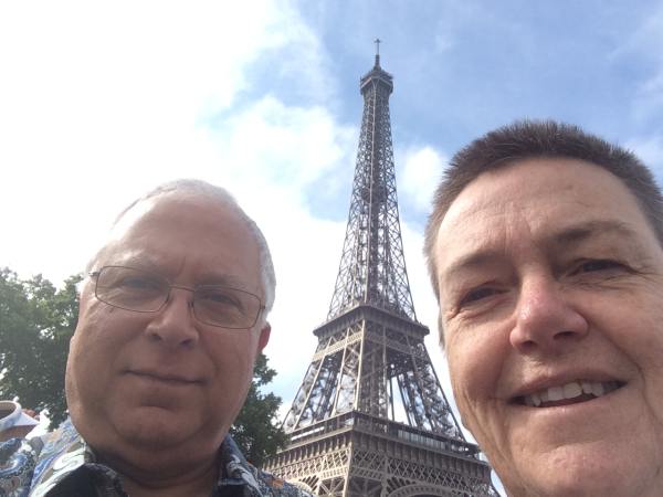 Selfie at the Eiffel Tower while waiting for a Seine river cruise.